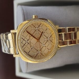 NWT Michael Kors gold watch with crystals. Comes with the box
